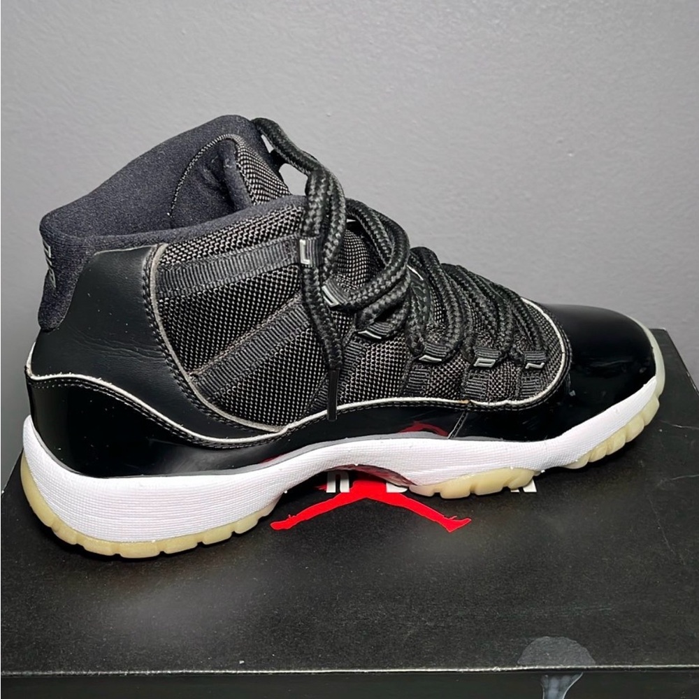 Jordan Retro 11 High-Top Sneakers in Black and White